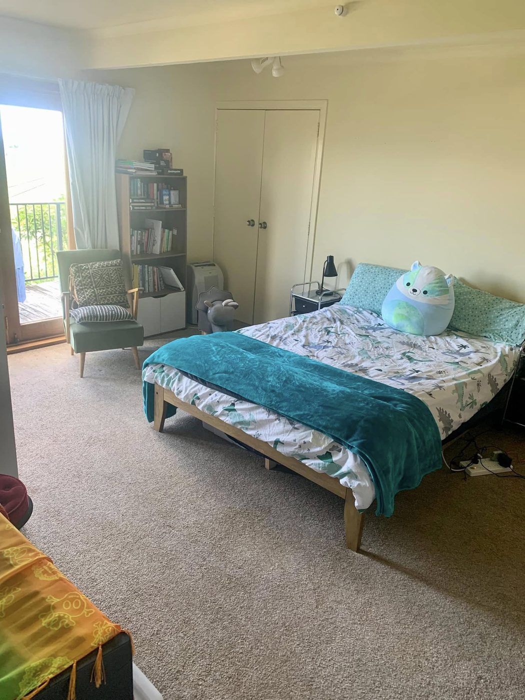 A tidy, made-up bedroom after a reset clean