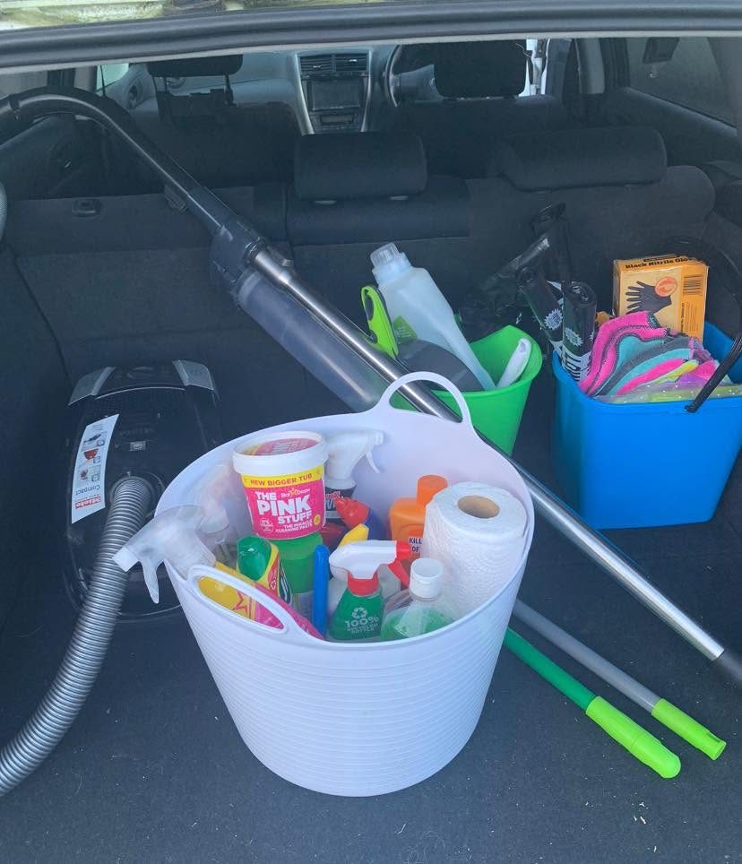 Cleaning supplies and equipment packed in a volunteer's car, ready for a reset clean